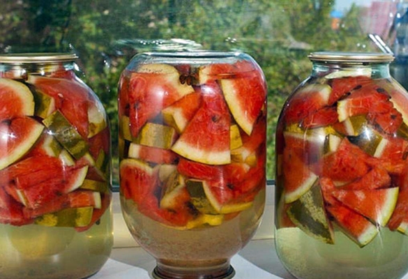 jars of pickled watermelons on the windowsill