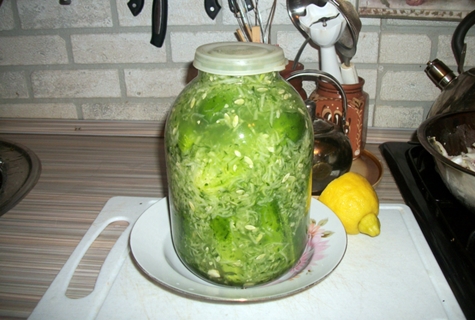 cucumbers in their own juice in a jar on the table
