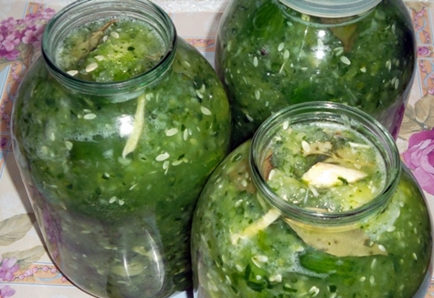 cucumbers in their own juice in jars on the table