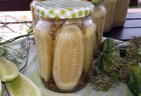 cucumbers with honey in a jar
