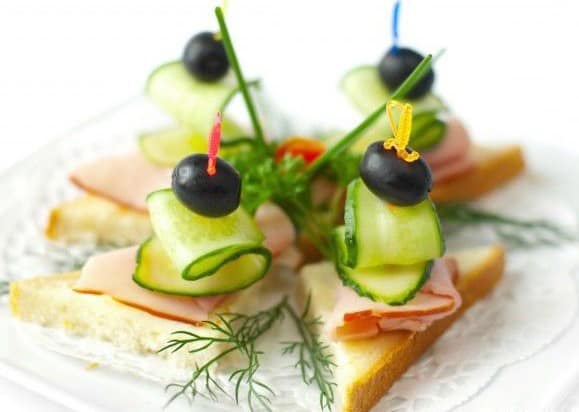 Canapes with boiled pork and cucumbers